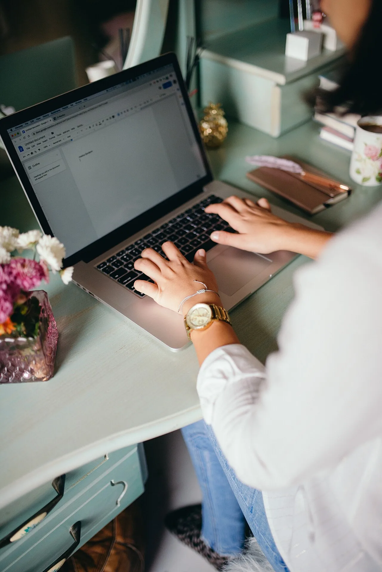 A woman using a laptop at home
